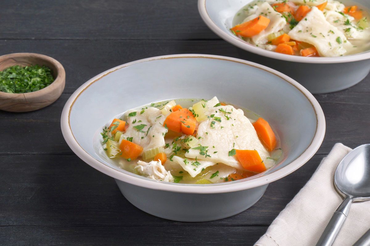 Chicken with Slippery Dumplings is ready and served in bowls