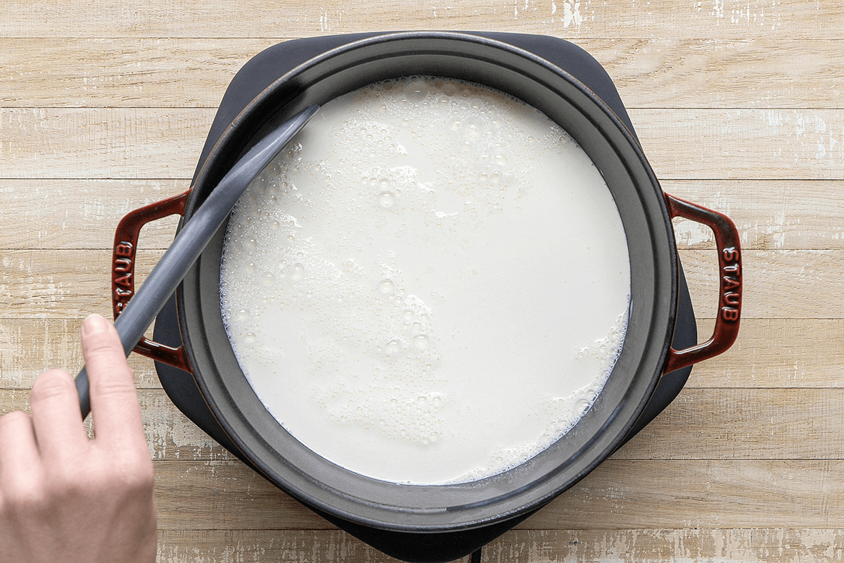 Stir in vinegar; let stand until curds form; about 5 minutes