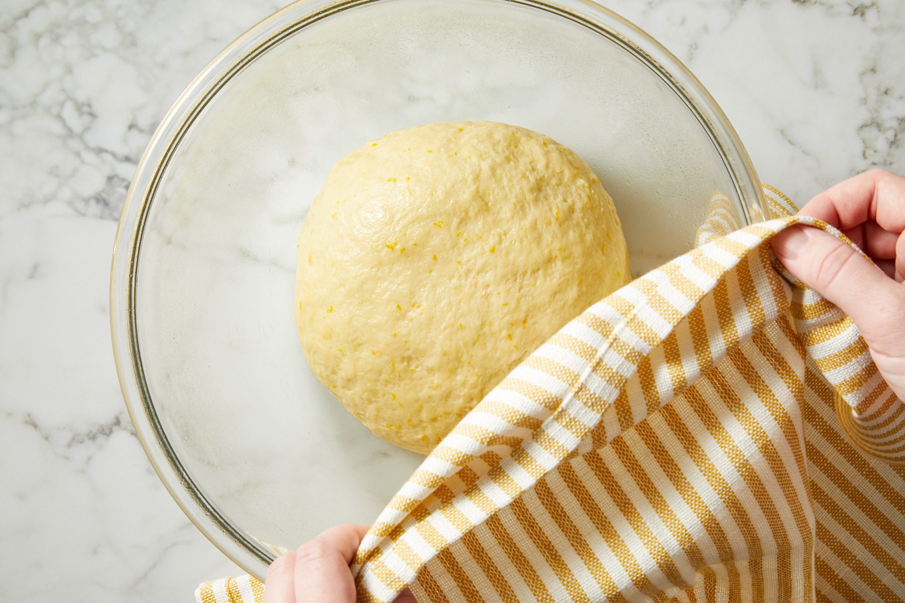 Overhead shot of place in a greased bowl; turning once to grease the top; Cover and let rise in a warm place until doubled about 1 hour;