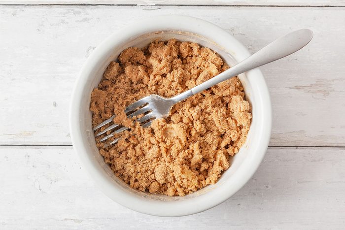 all-purpose flour, brown sugar, cinnamon, salt and softened, cubed butter being mixed in a shallow bowl