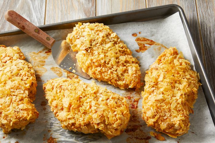 Baked Potato Chip Chicken on foil-lined baking sheets