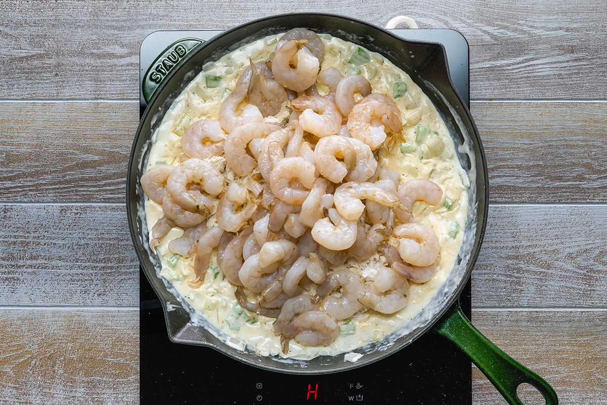 Fold in shrimp and crab into the skillet