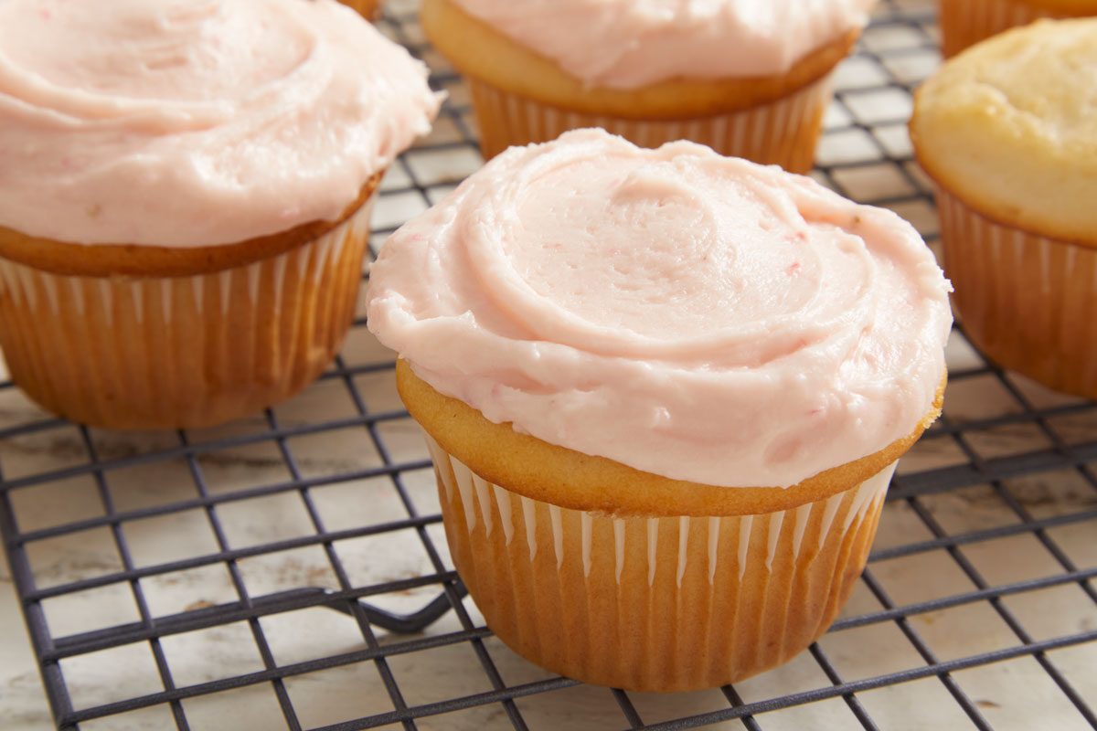 Close up shot of Strawberry Cream Cheese Frosting on cupcakes
