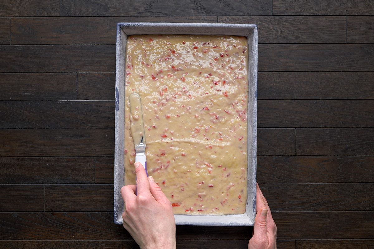 overhead shot of a prepared mix spread evenly on baking tray