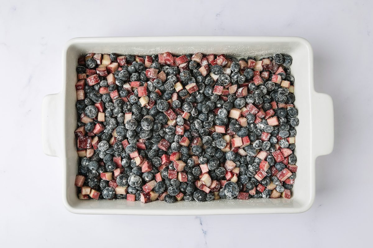 blueberries, rhubarb, sugar and flour in a large baking dish