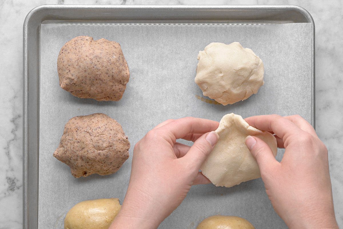 Topping being added on the dough roll 