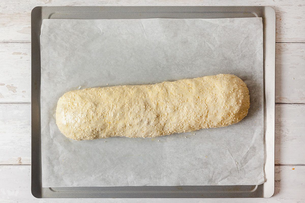 Pizza dough being rolled up