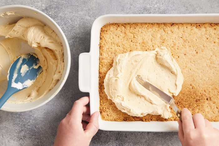 Spoon whipped topping over crust.