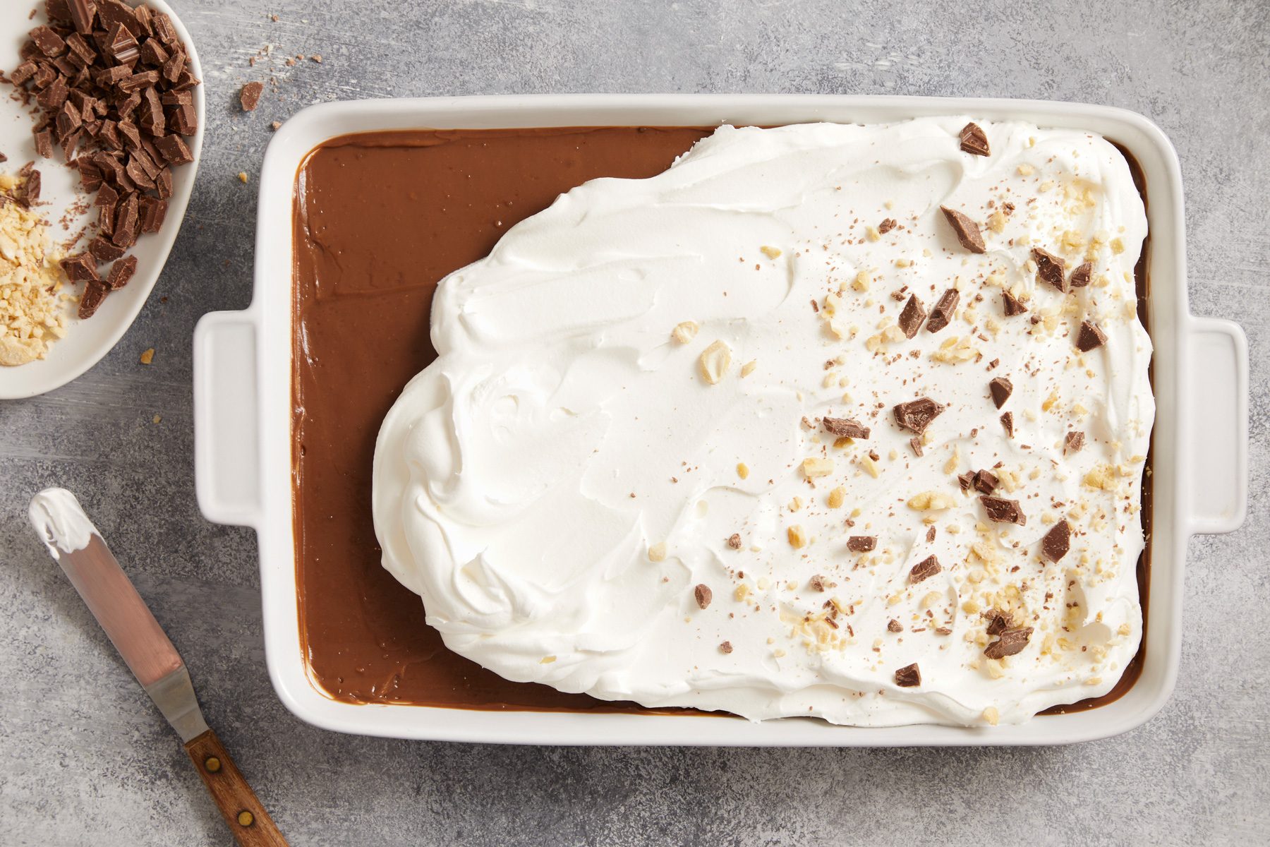Top with remaining whipped topping. Sprinkle with chopped candy bar and remaining cashews.