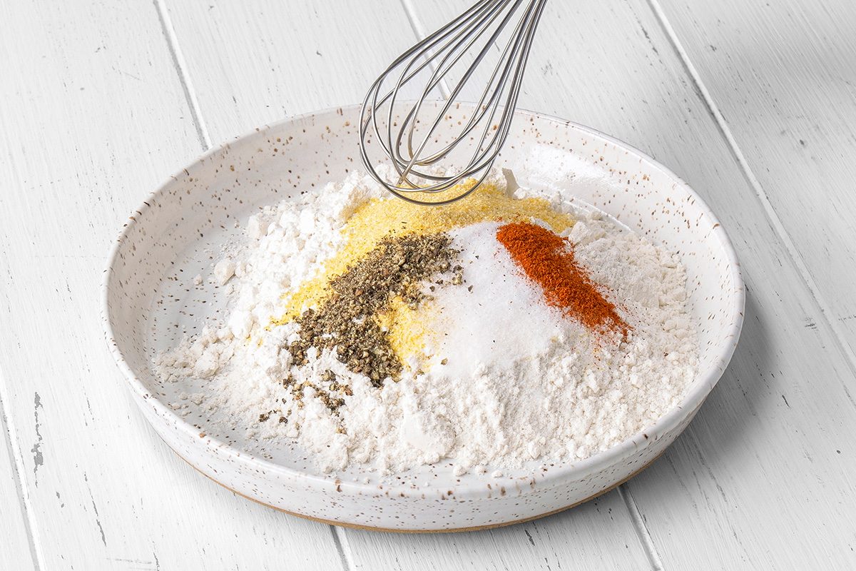 Combine flour, cornmeal, salt, pepper and cayenne; place on a shallow plate.