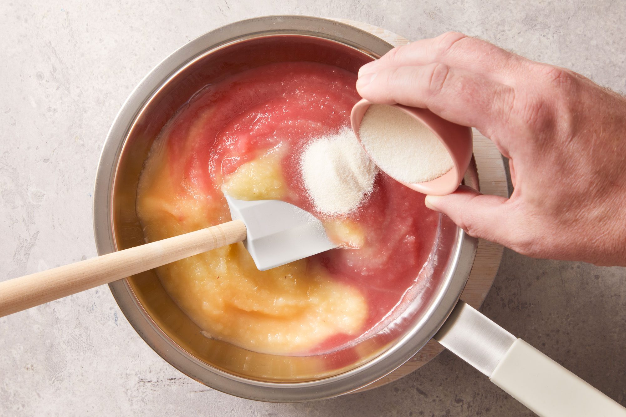 In top of a double boiler or a metal bowl over simmering water, combine both applesauce and gelatin until gelatin is dissolved