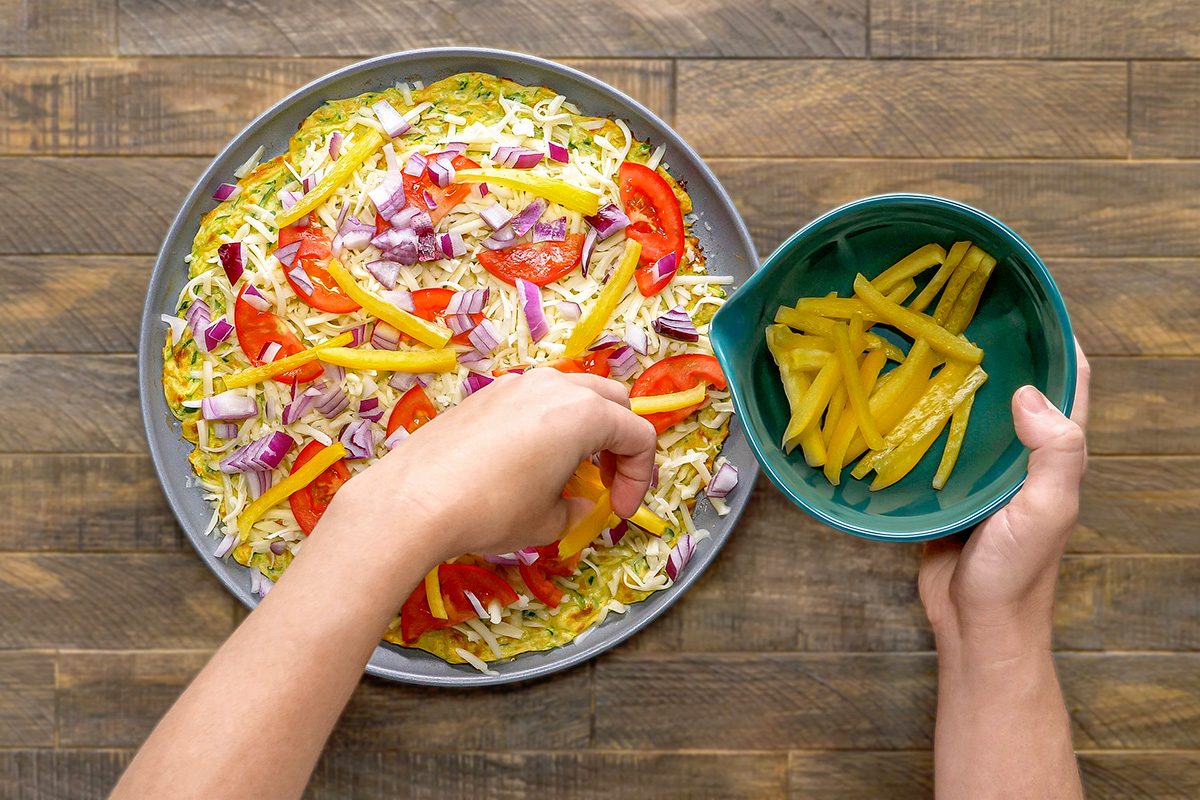 Top the pizza with onion and pepper