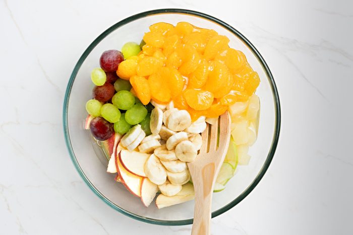 combine all the fruits together with a spatula