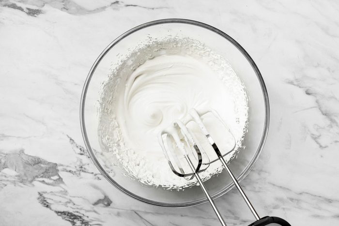 In a large bowl, beat cream until stiff peaks form