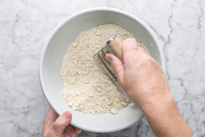 mixing dough with butter