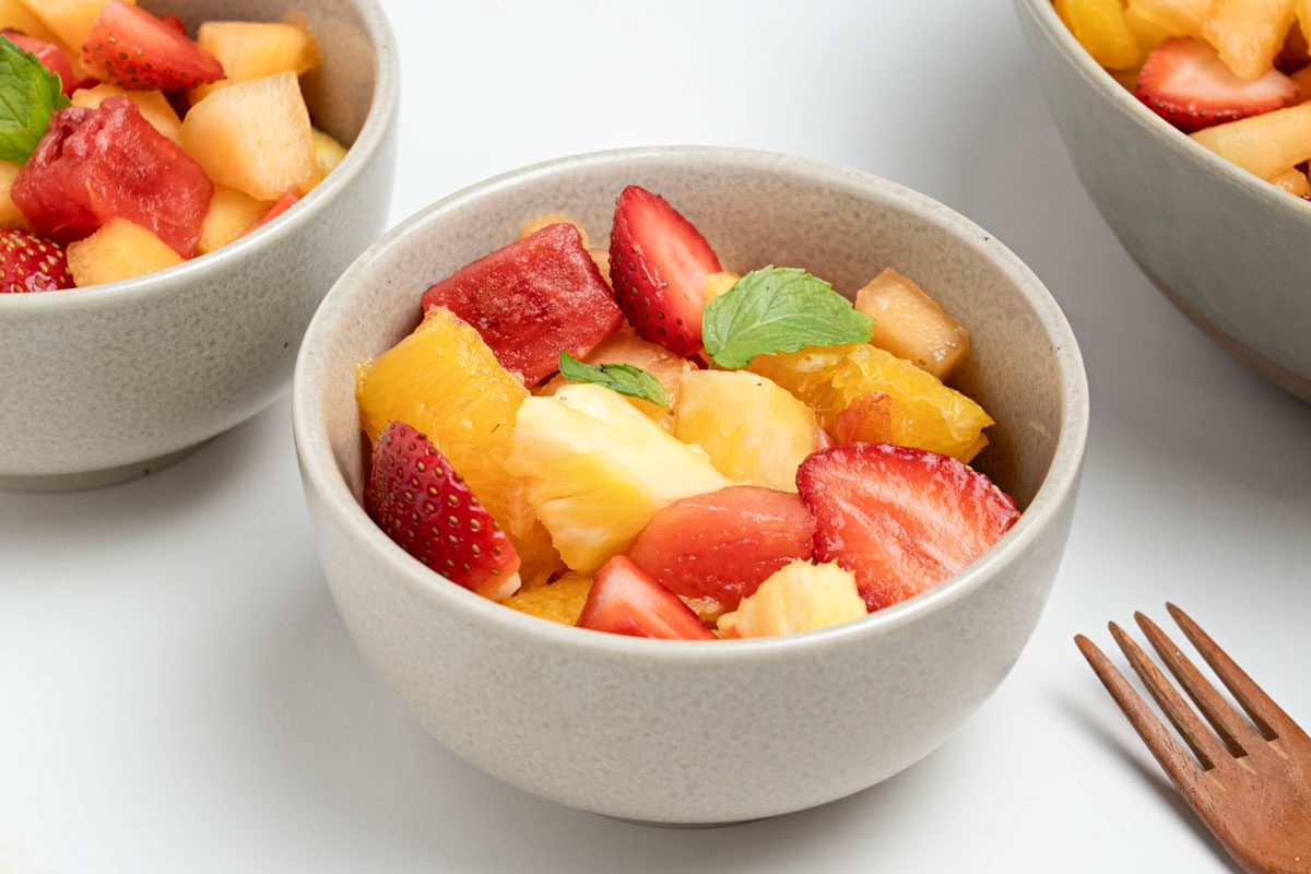 3/4 shot of Fresh Fruit Bowl garnished with mint leaves