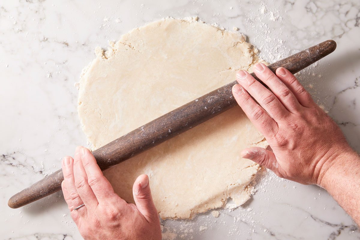 On a lightly floured surface, roll dough to a 1/8-in.-thick circle;