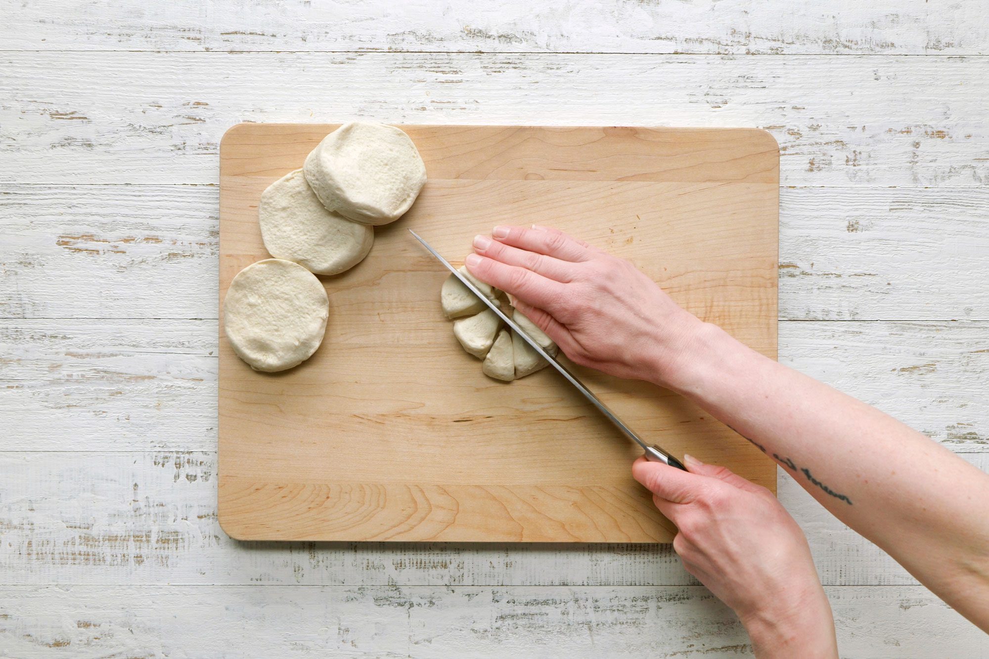 Cut each biscuit into 8 pieces on a wooden chopping board