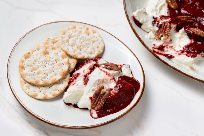 3/4 shot of Raspberry Chipotle Dip served with crackers