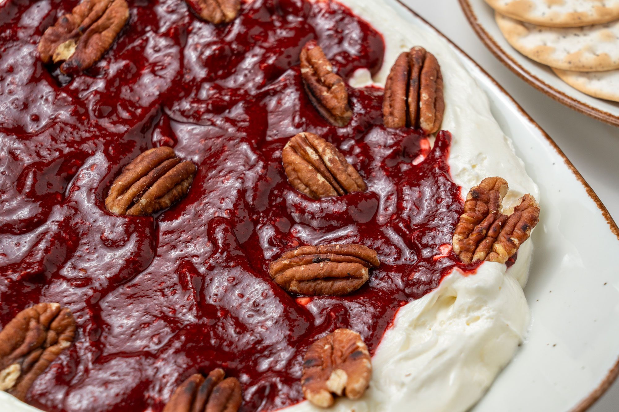 Close up shot of Raspberry Chipotle Dip served with crackers