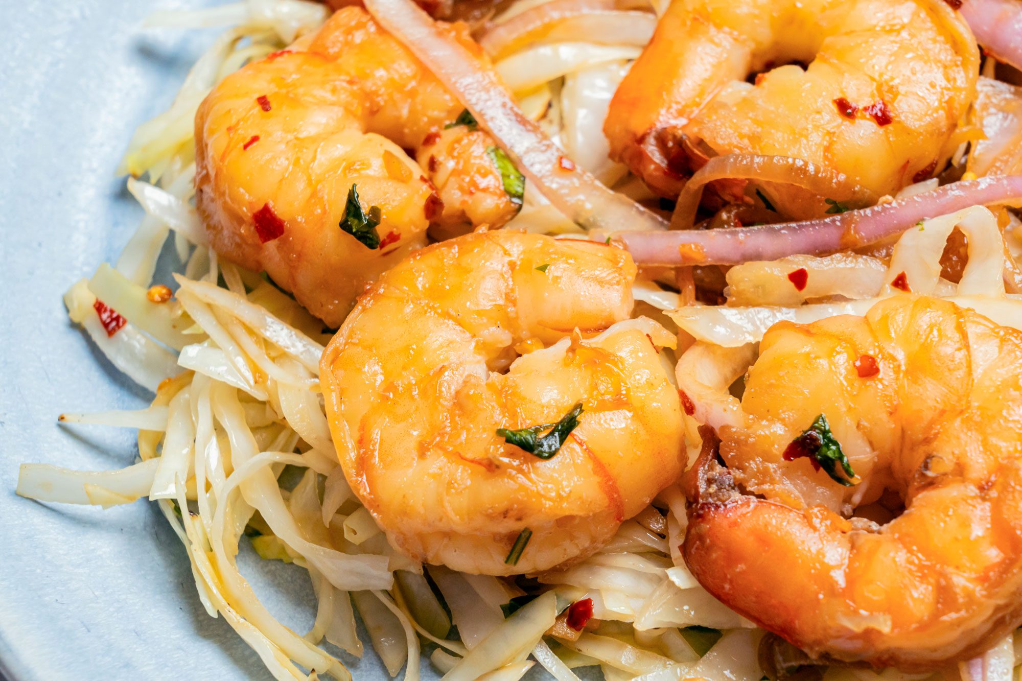Close up shot of Thai Shrimp served and Cabbage.