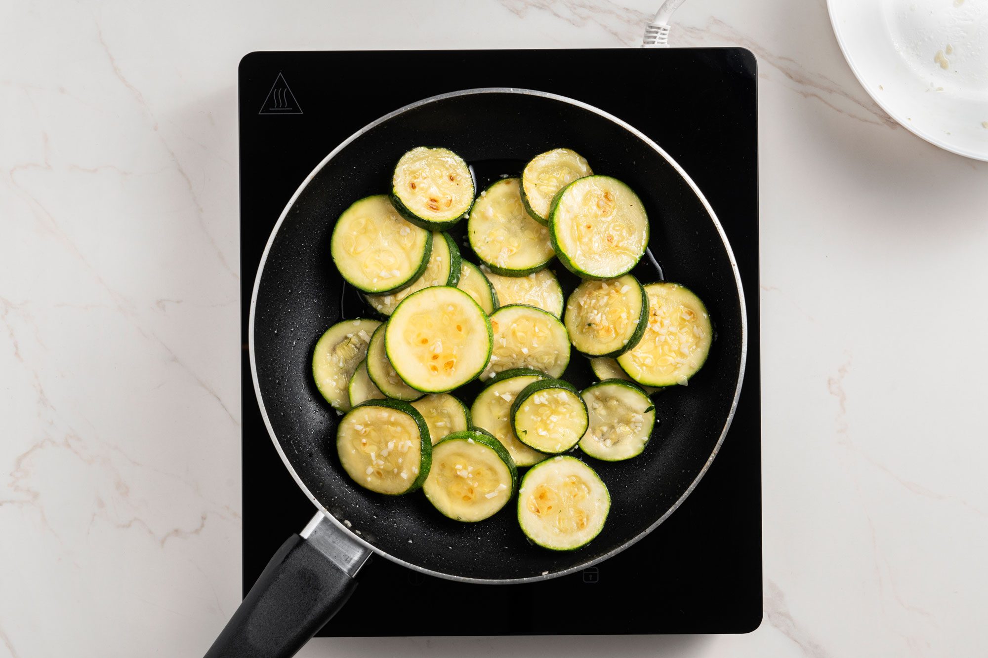 Add zucchini; toss to coat