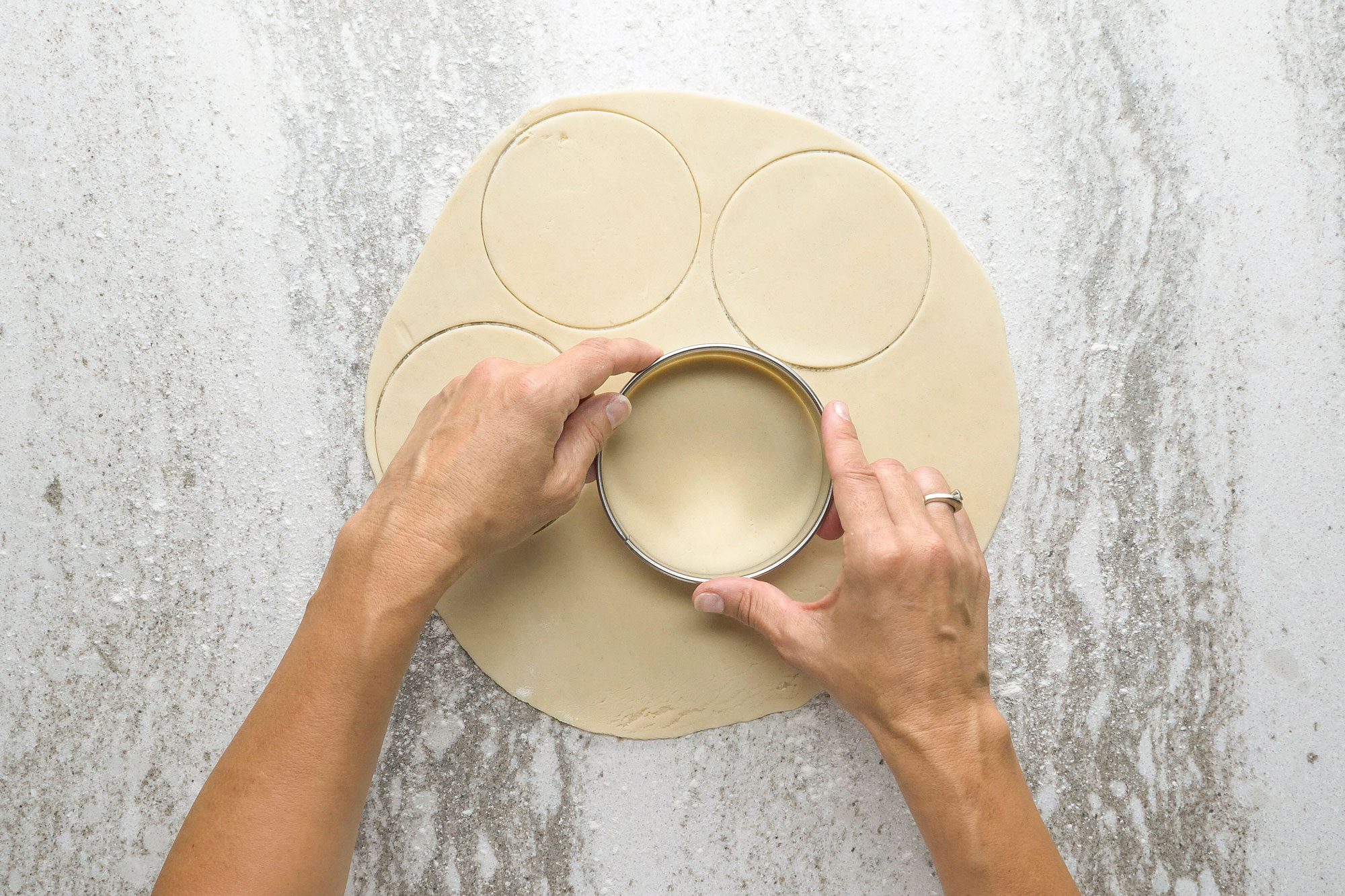 On a lightly floured surface unroll crusts; Cut out six 4 inches circles
