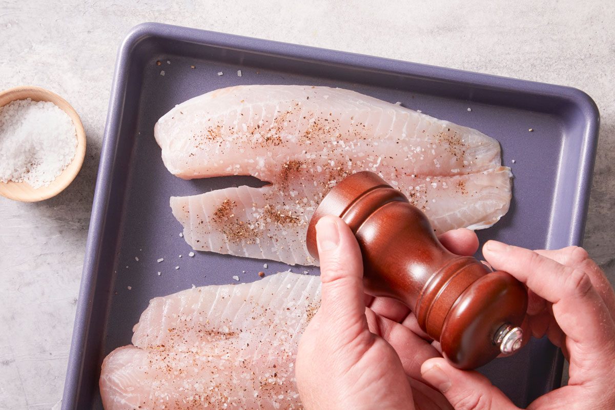 Place tilapia on a baking sheet coated with cooking spray; sprinkle with salt & pepper.