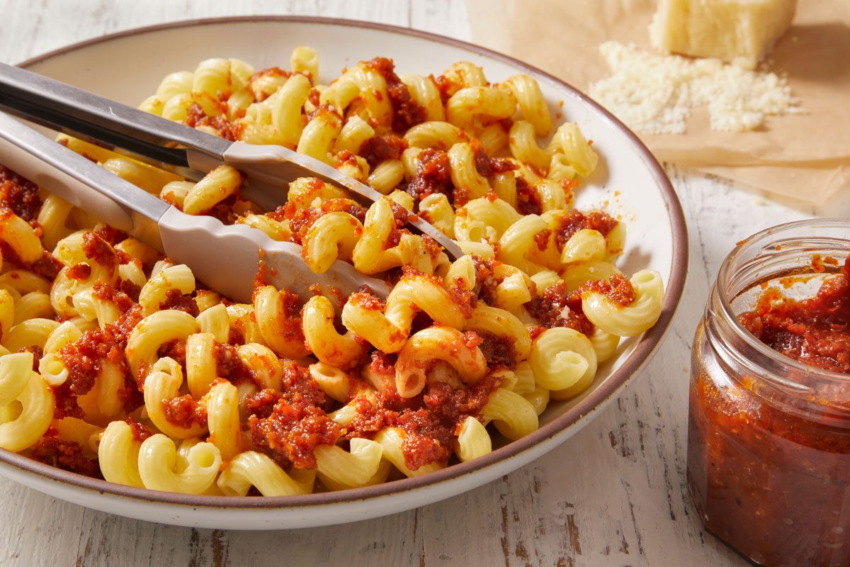 3/4 shot of Sun-Dried Tomato Pesto mixed with macaroni