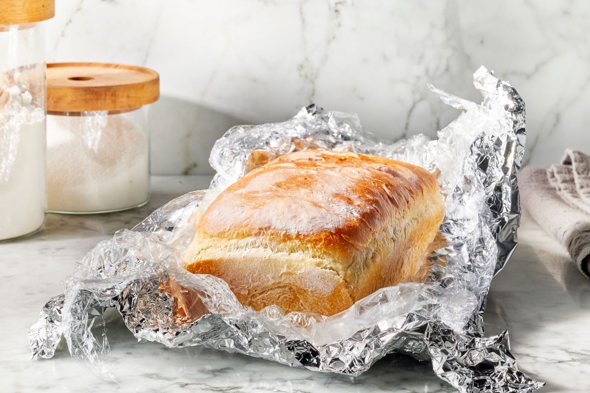 loaf of bread unwrapped from foil and plastic wrap