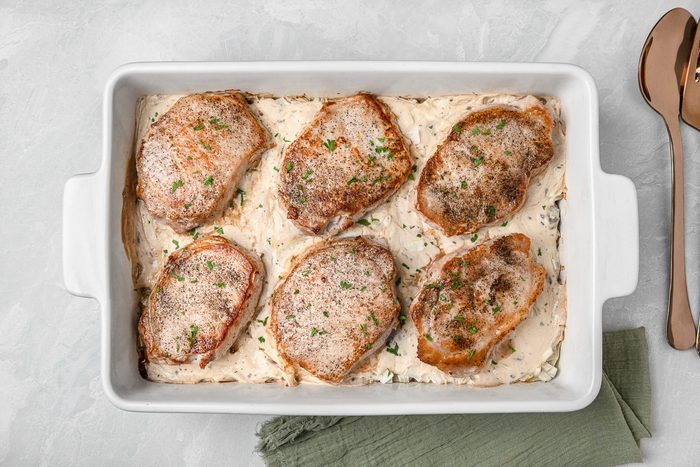 pork chops with potatoes in baking dish