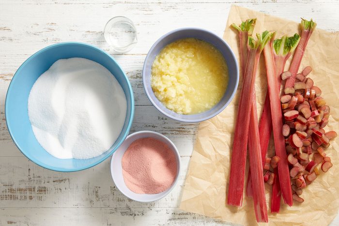 Rhubarb Pineapple Jam ingredients in bowls and on a parchment paper.