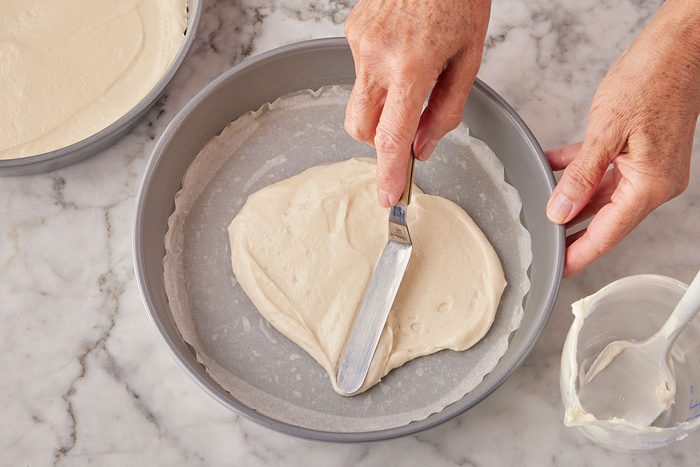 Prepared batter being layered in the baking sheet