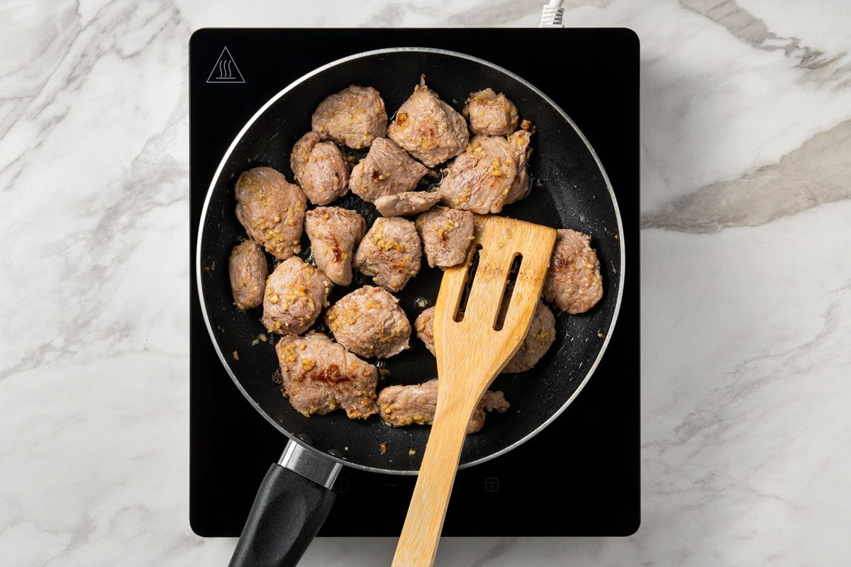 stir-fry until pork is lightly browned.