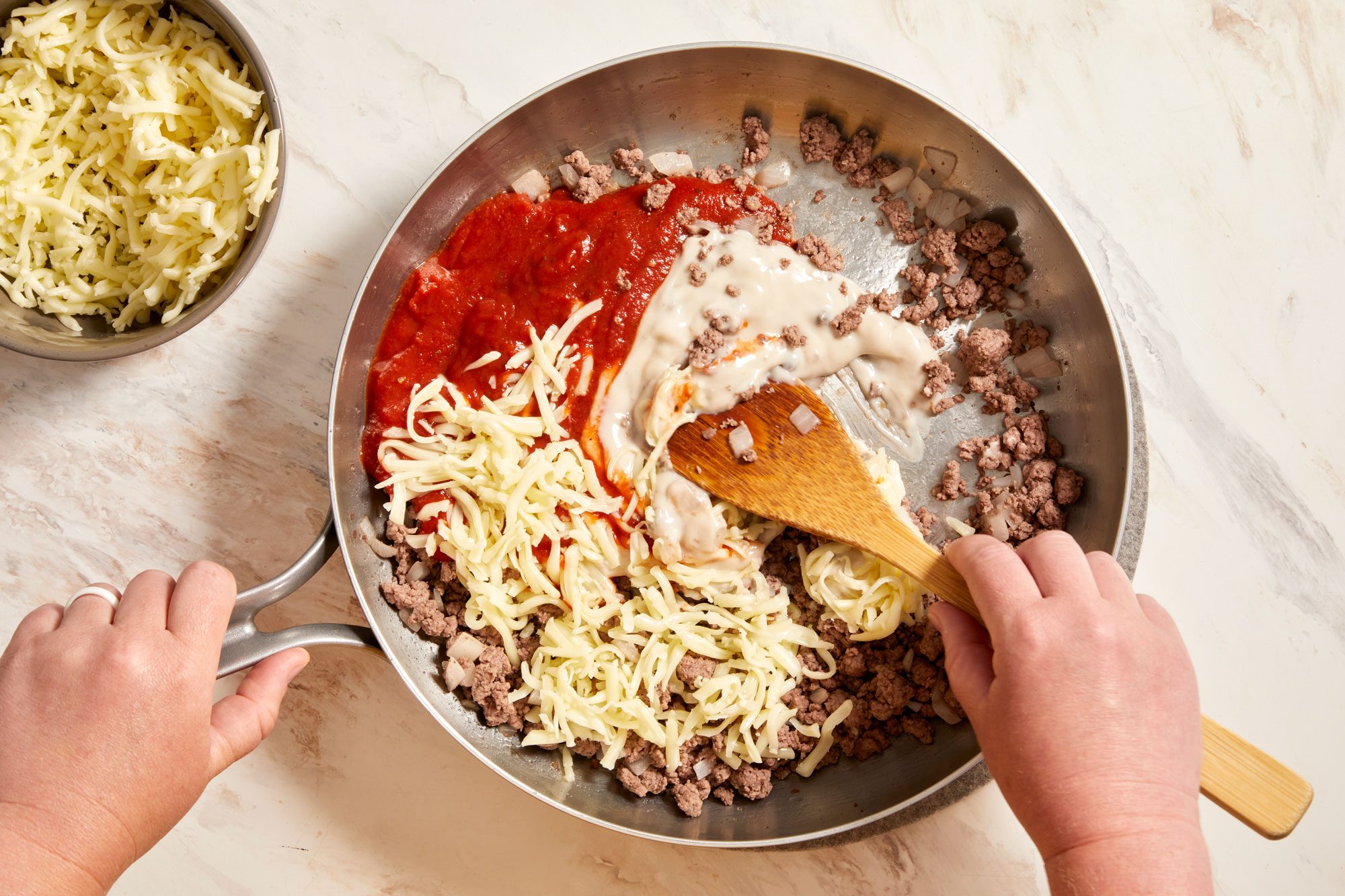 Add pizza sauce, soup and cheese;