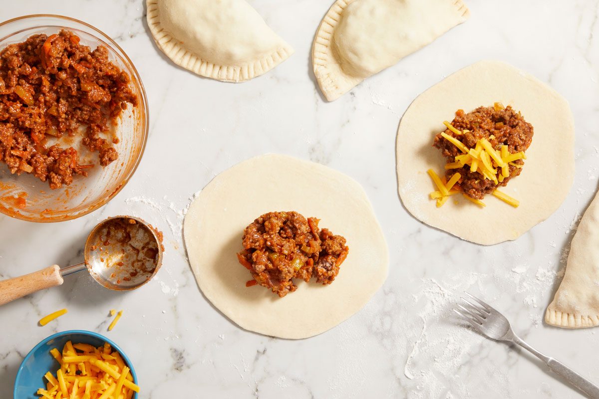 Spoon scant 1/3 cup beef mixture over half of each circle