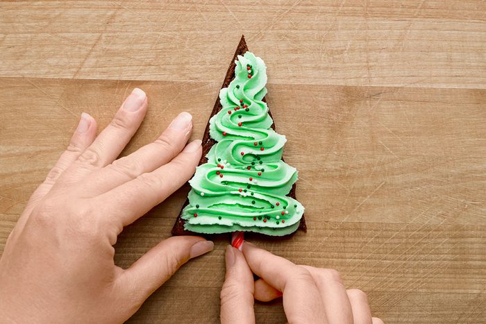 add a mini candy to make the trunk for a tree for Christmas Tree Brownies