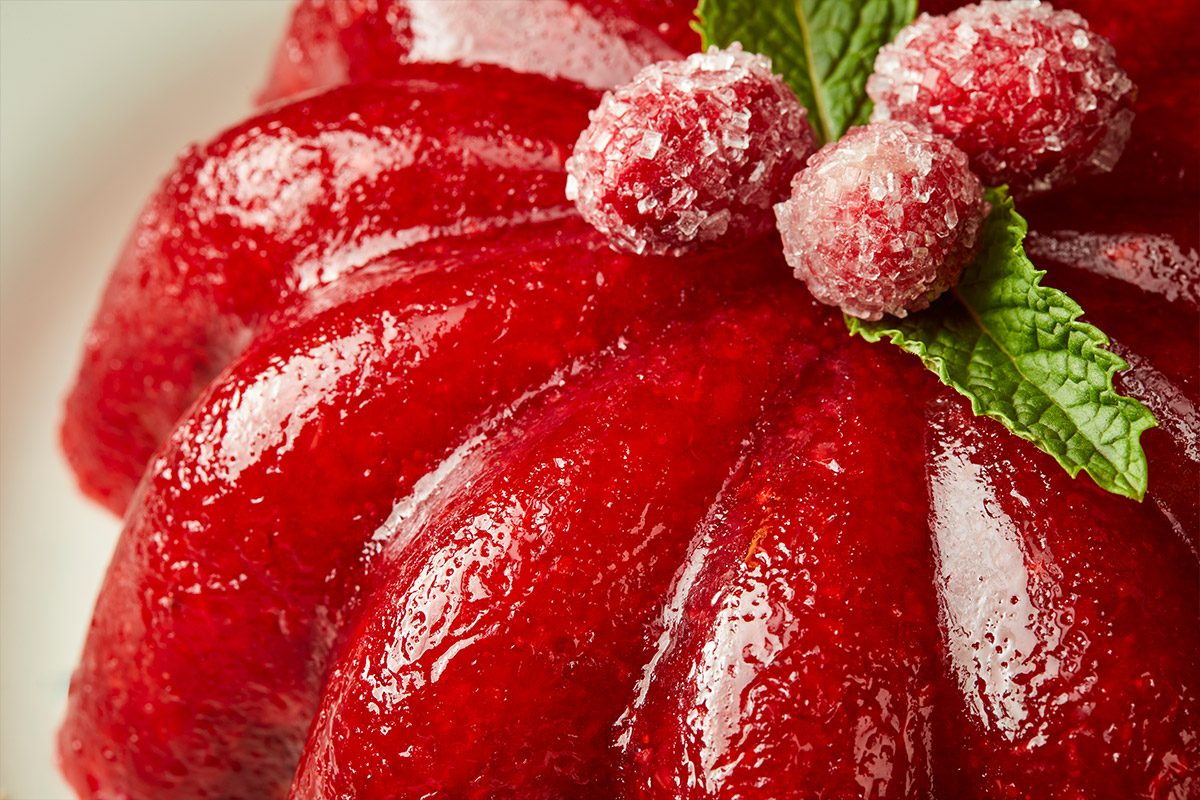 Closeup shot of Molded Cranberry-Orange Salad; served on a platter;