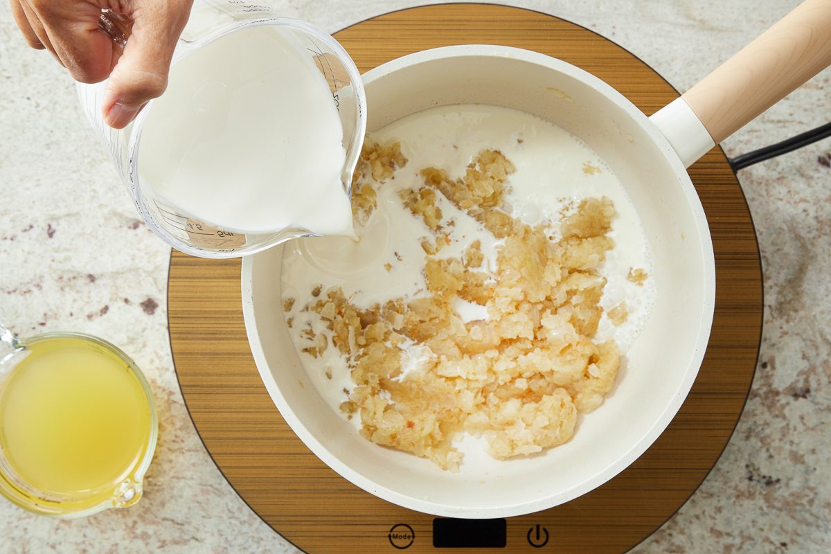 cream being added to cooked onions