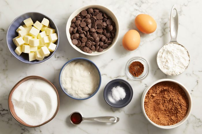 Ingredients for Sourdough Brownies in bowls on a counter.