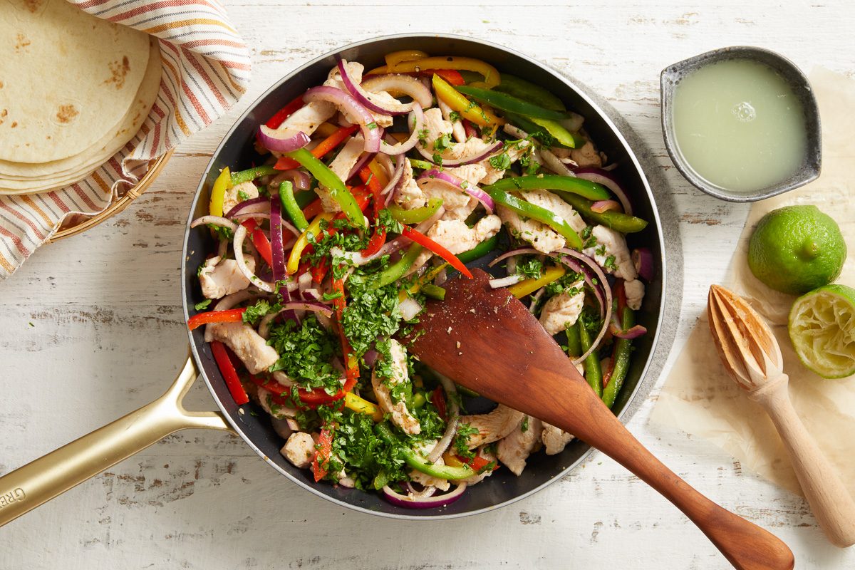 cilantro and lime juice being stirred in with turkey mixture