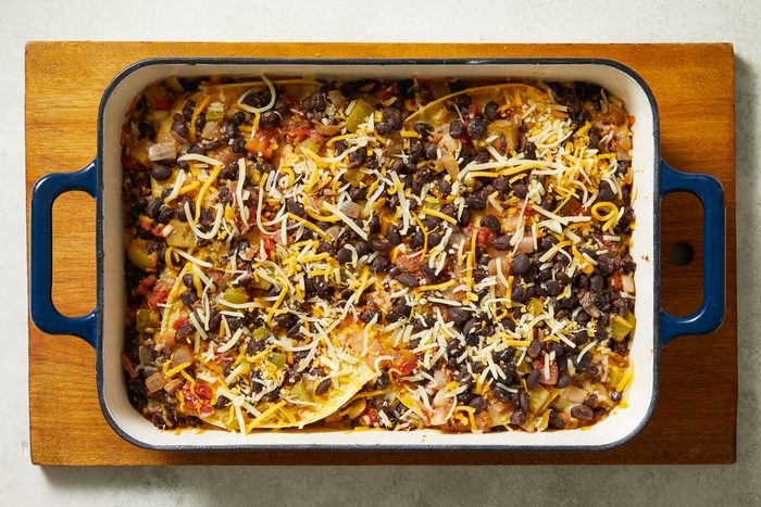 baked casserole sprinkled with shredded cheese