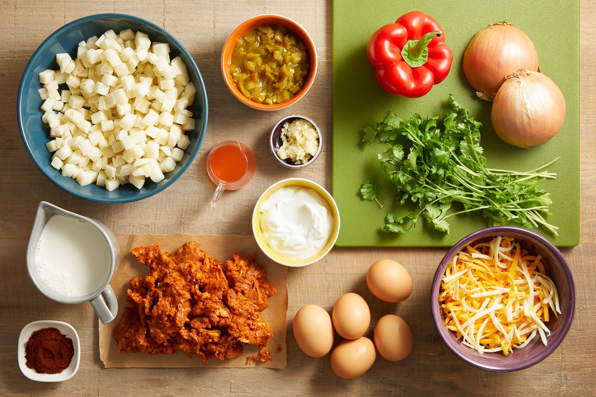 chorizo, frozen hash brown potatoes, onion, sweet red pepper, garlic cloves, eggs, half and half cream, chili powder, shredded cheese, cilantro and chopped green chiles