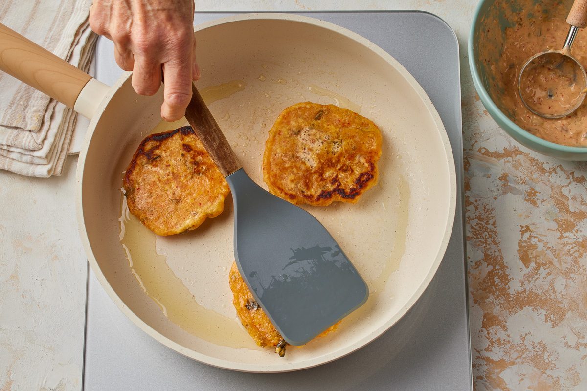flipped pancakes in pan