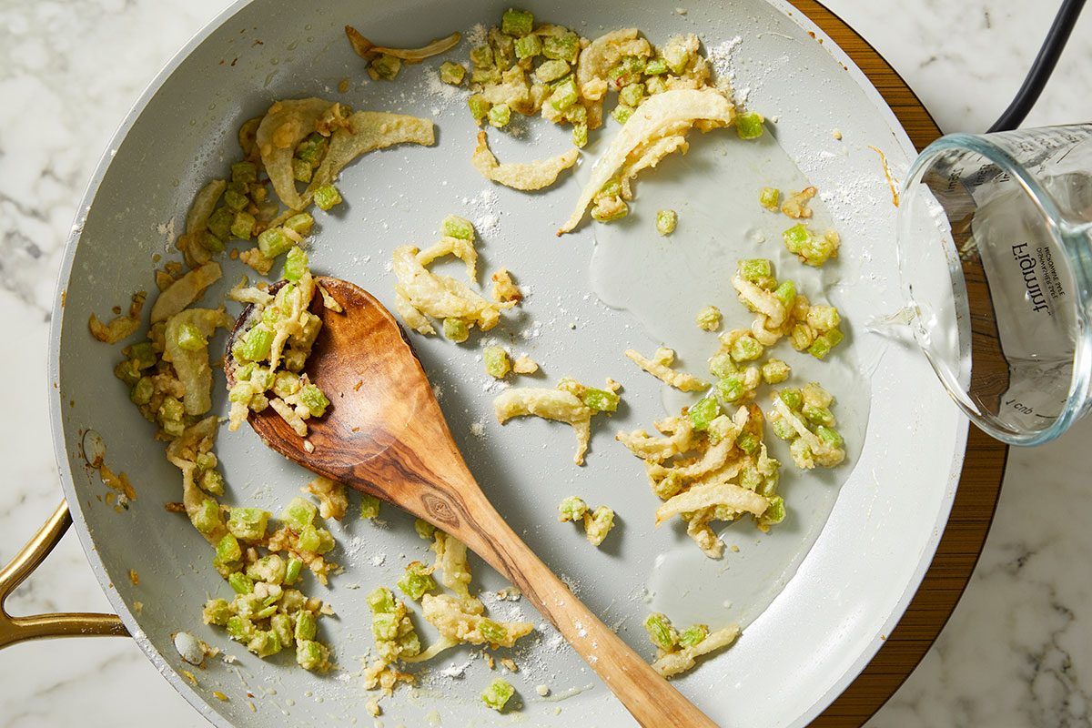 An overhead, horizontal step-by-step image showing fennel bulb, chopped celery, and garlic sautéed in butter and olive oil as the flavor base for Million-Dollar Gnocchi.