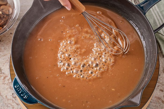 Stir in the beef broth, Worcestershire sauce, red wine vinegar, bouillon, salt and pepper and bringing to boil in a large skillet.