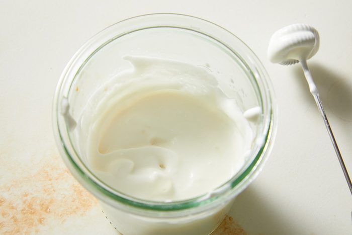 Overhead view of the finished whipped cream mixture smoothed and ready for topping, showing a silky texture designed to float on top of a Red Velvet Espresso Martini.