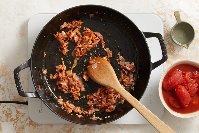 cooking prosciutto in a large skillet