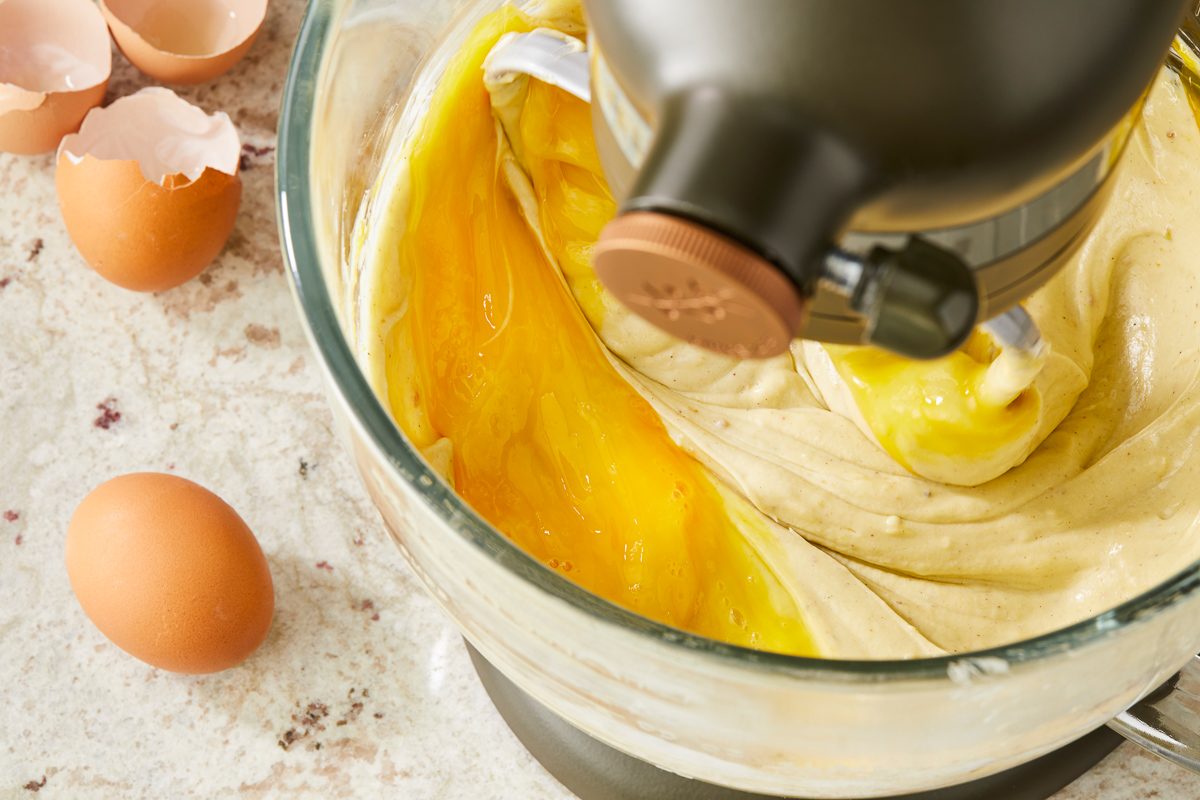 eggs being beaten in with cheesecake filling