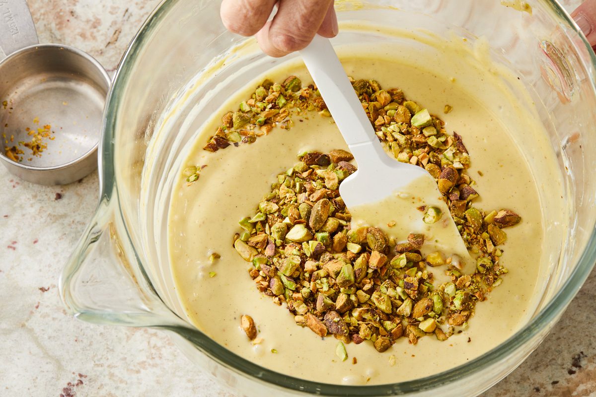 folding in pistachios with rubber spatula